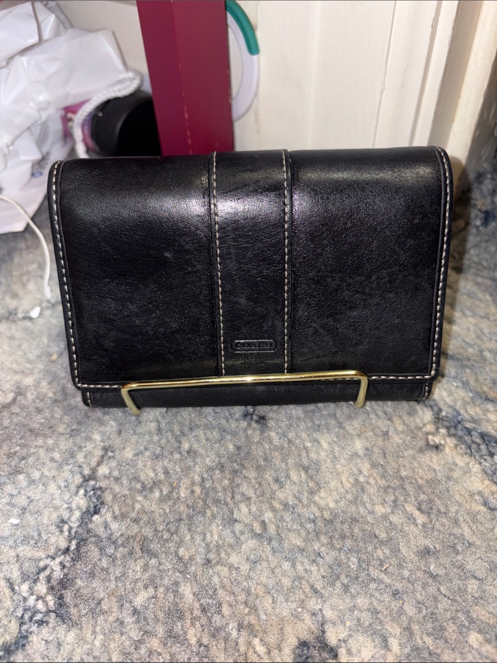 Coach Black Leather Wallet with Gold Bar Accent